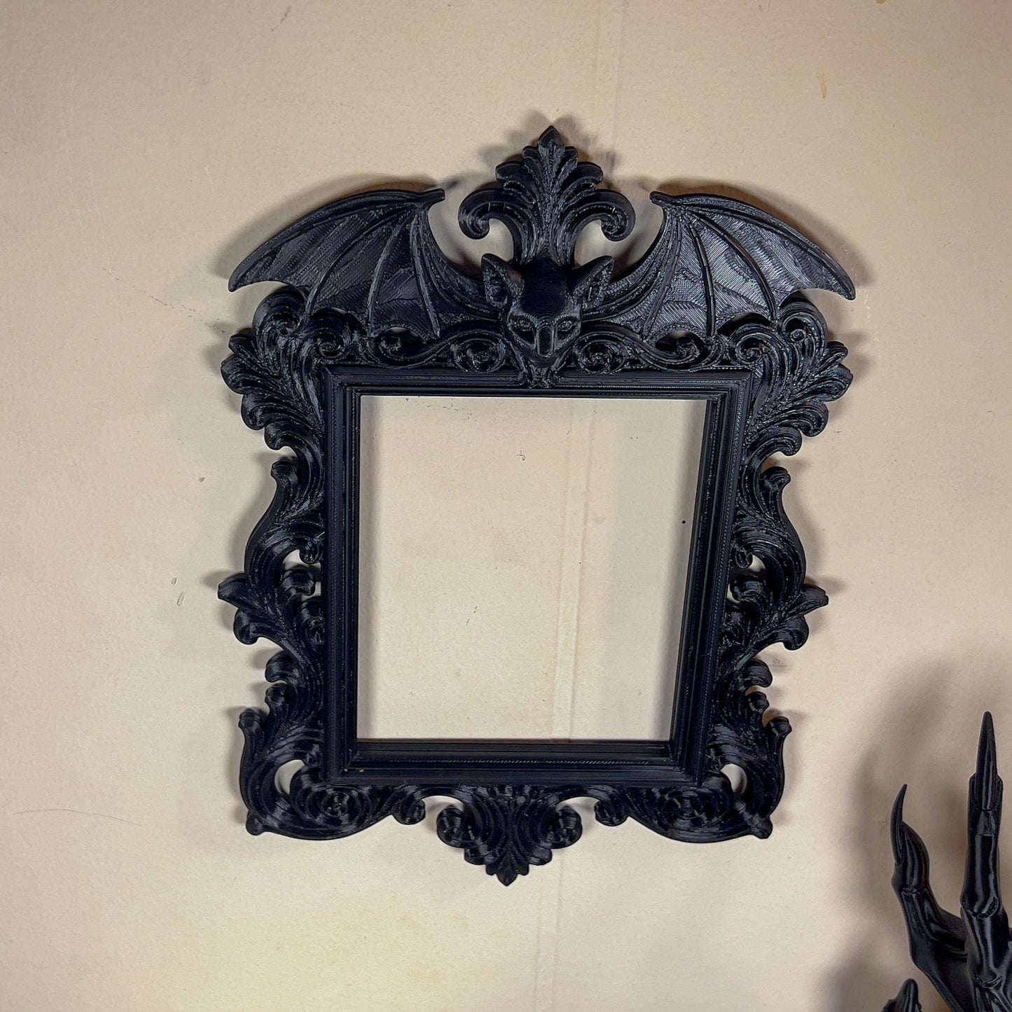 Decorative black frame on a plain wall